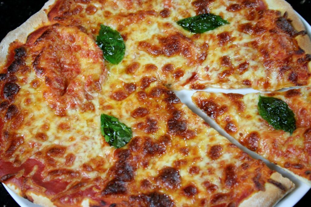 pizza with basil leaves