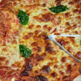 pizza with basil leaves