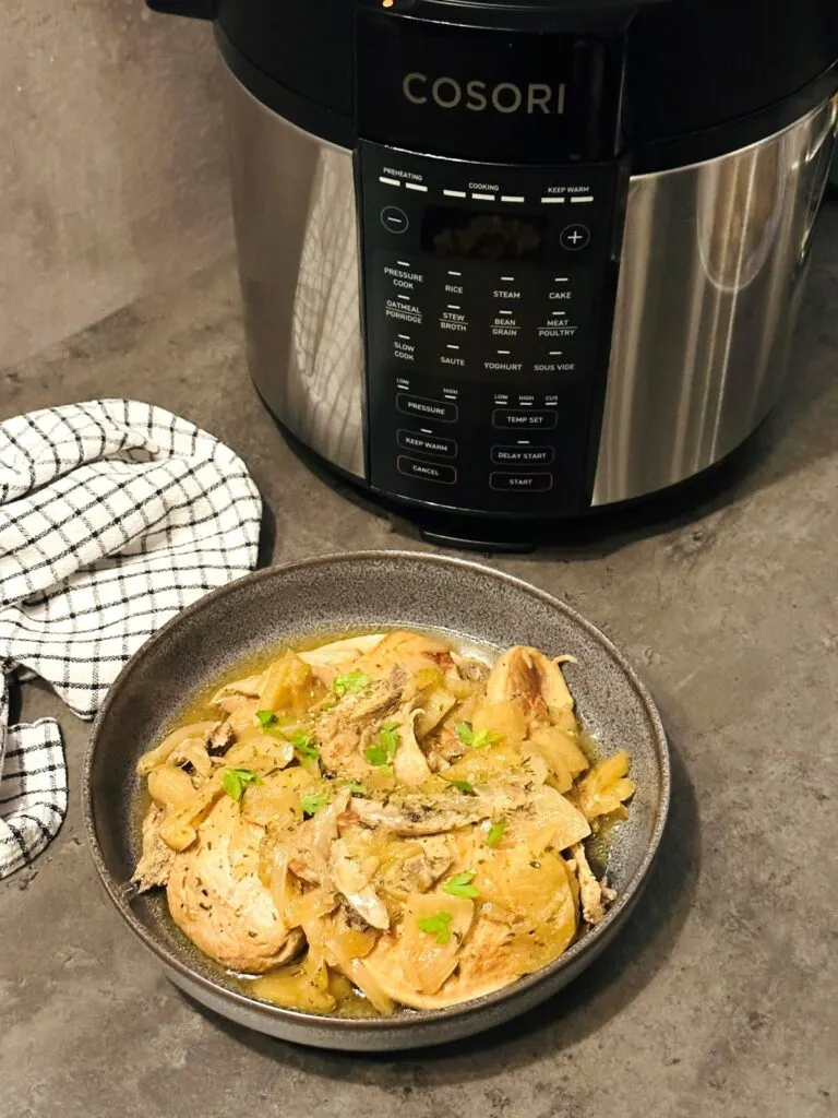 pork chops and apple next to Cosori multi-cooker
