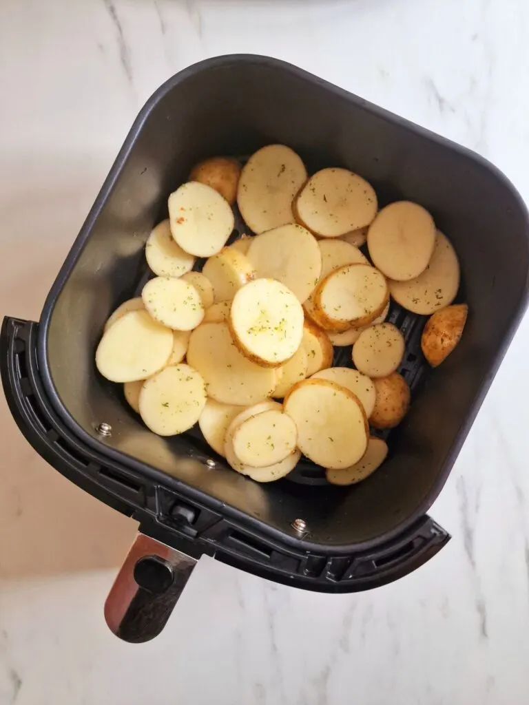 potato slices in air fryer basket