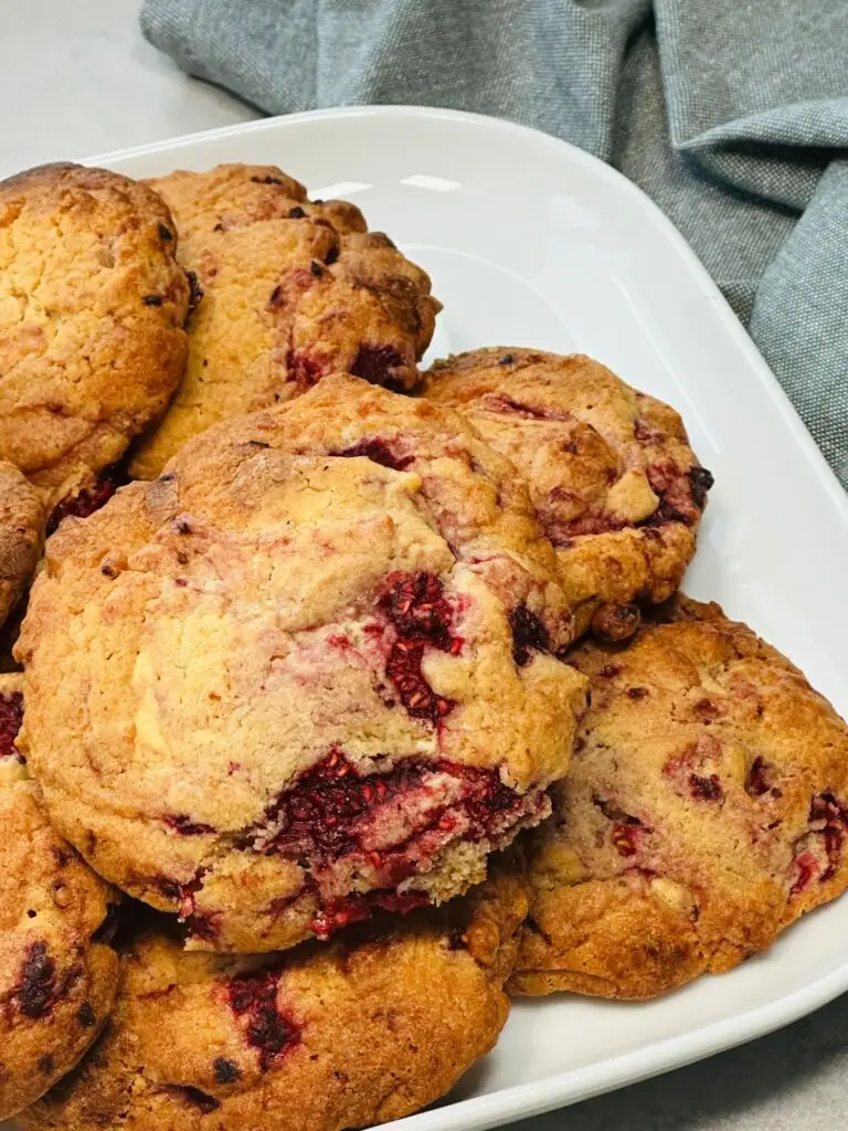 baked raspberry and white chocolate cookies on a plate