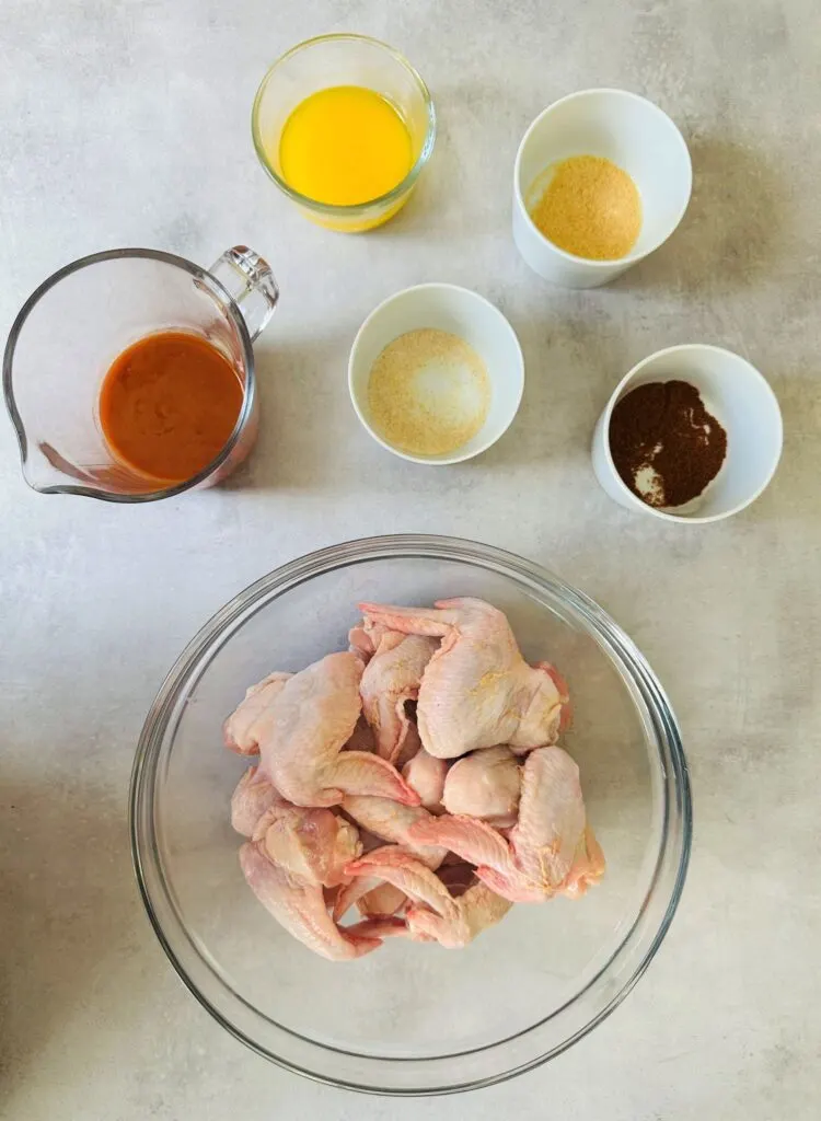 raw chicken wings in bowl