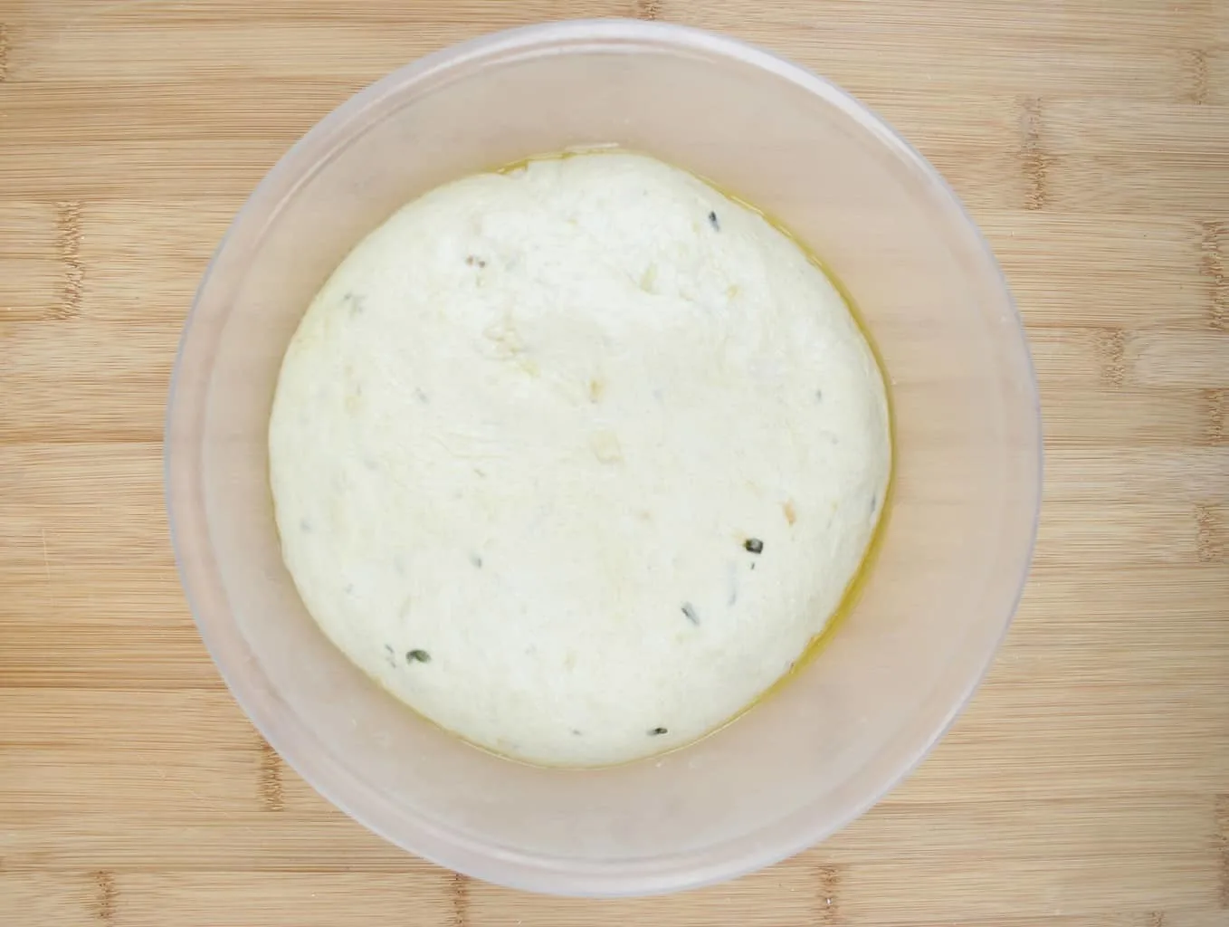 risen dough in bowl