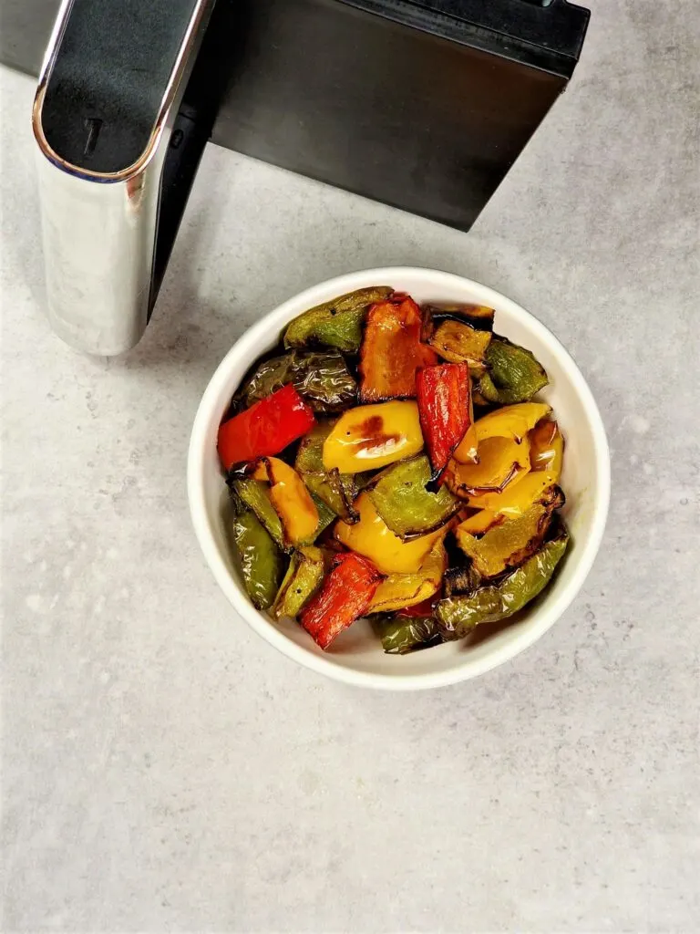 roasted peppers next to an air fryer