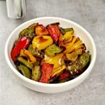roasted peppers next to an air fryer