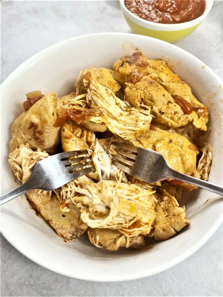 shredding chicken in bowl