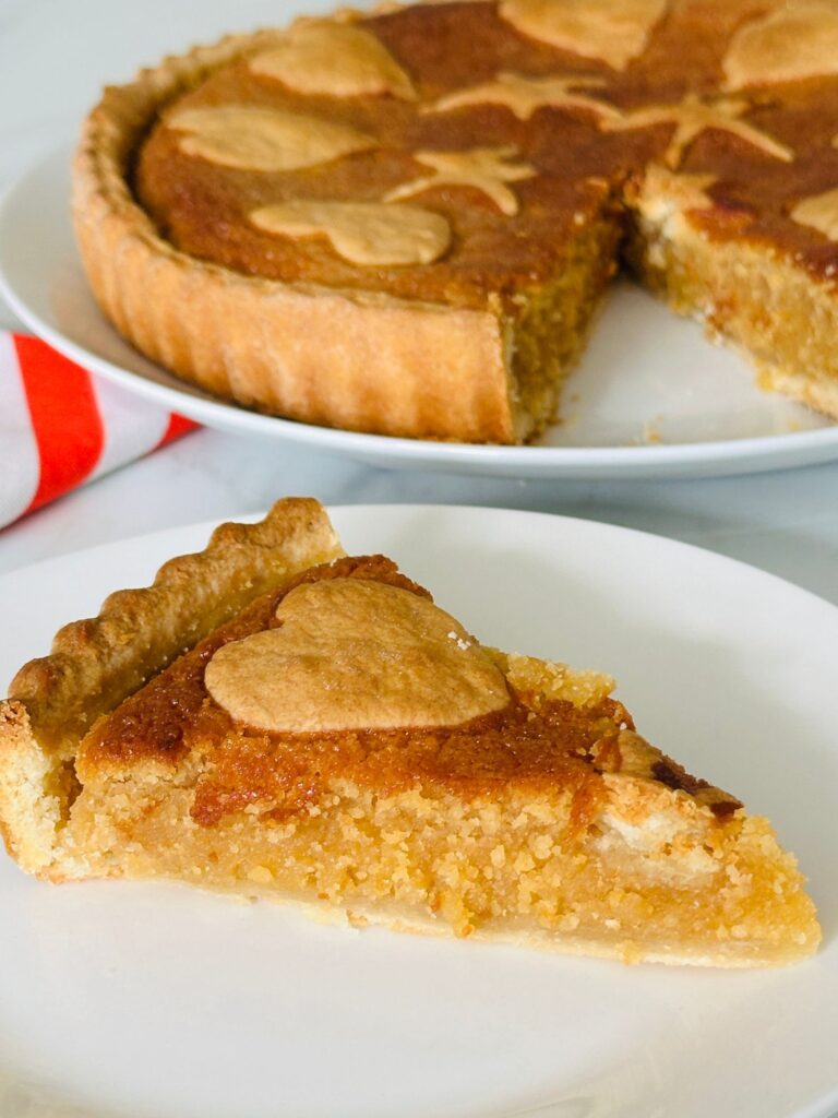 slice of treacle tart on a plate