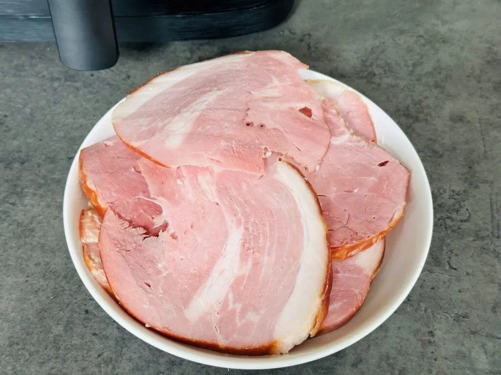 sliced gammon next to air fryer