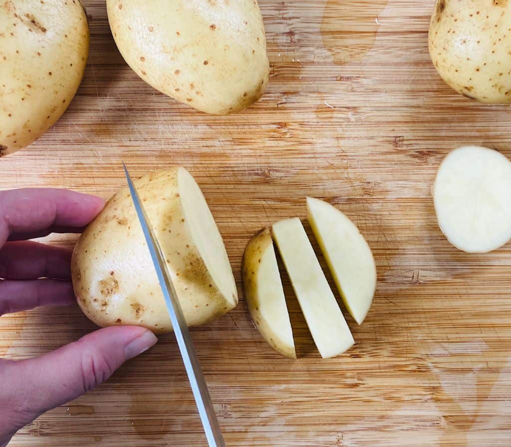 knife slicing potatoes for chips