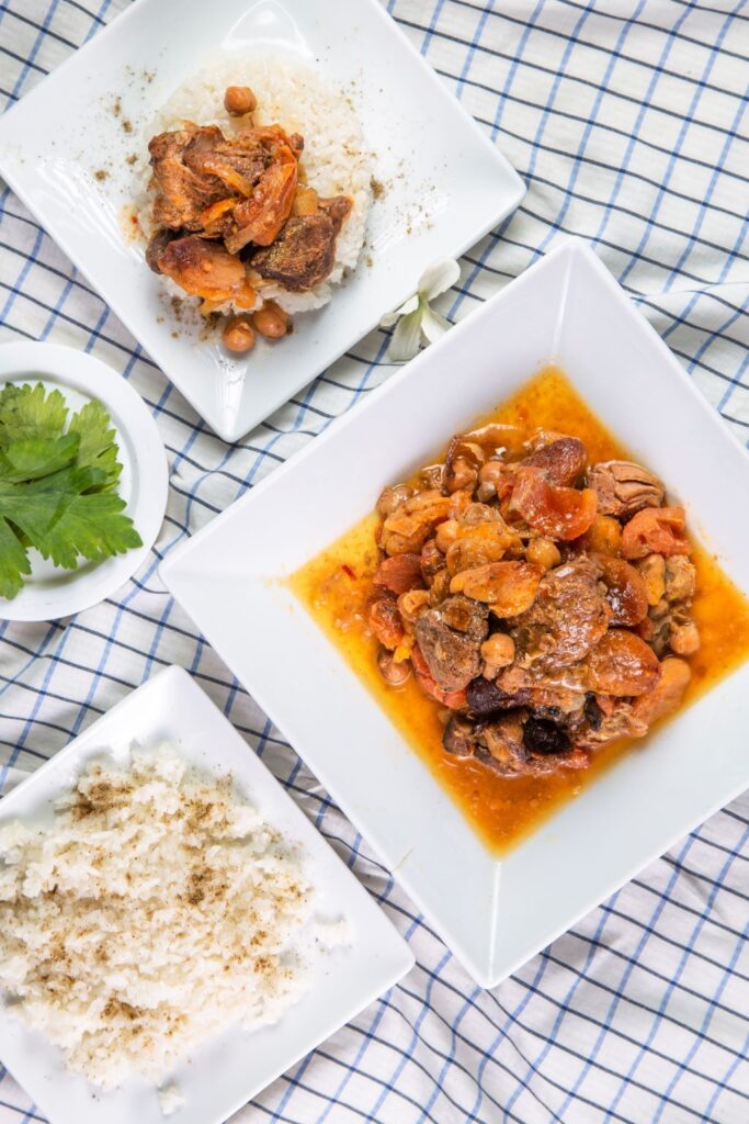 slow cooker lamb tagine and rice served on plates