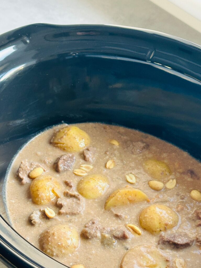 cooked beef massaman curry in a slow cooker