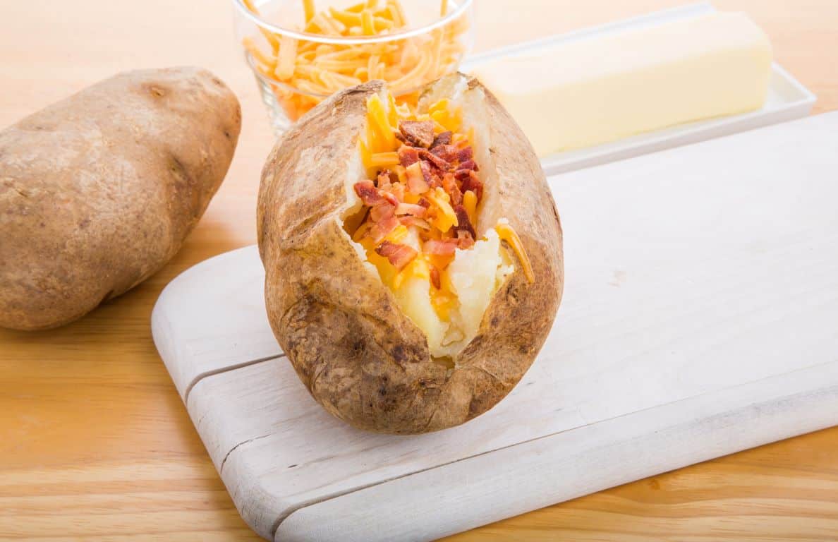 slow cooker jacket potatoes with cheese and bacon topping