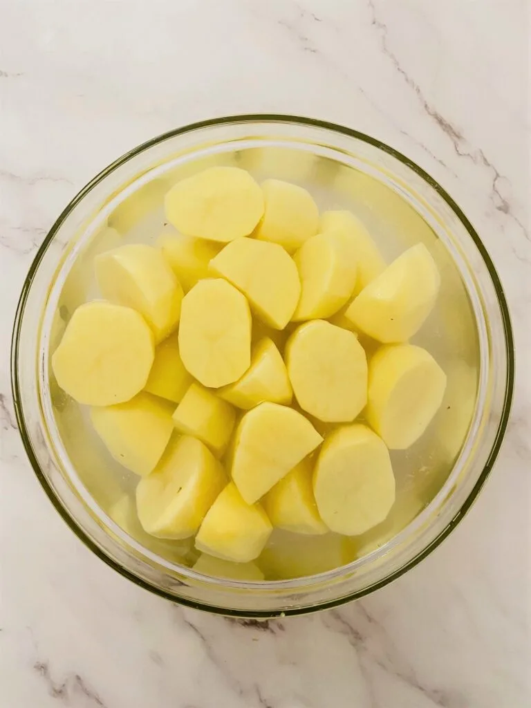 soaking peeled potatoes in water before roasting