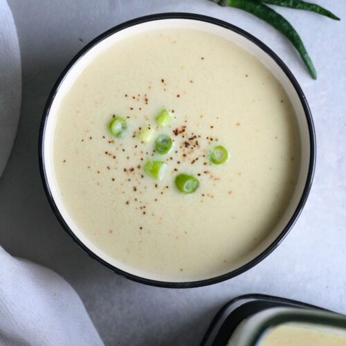 chicken coconut green chilli soup in a soup bowl