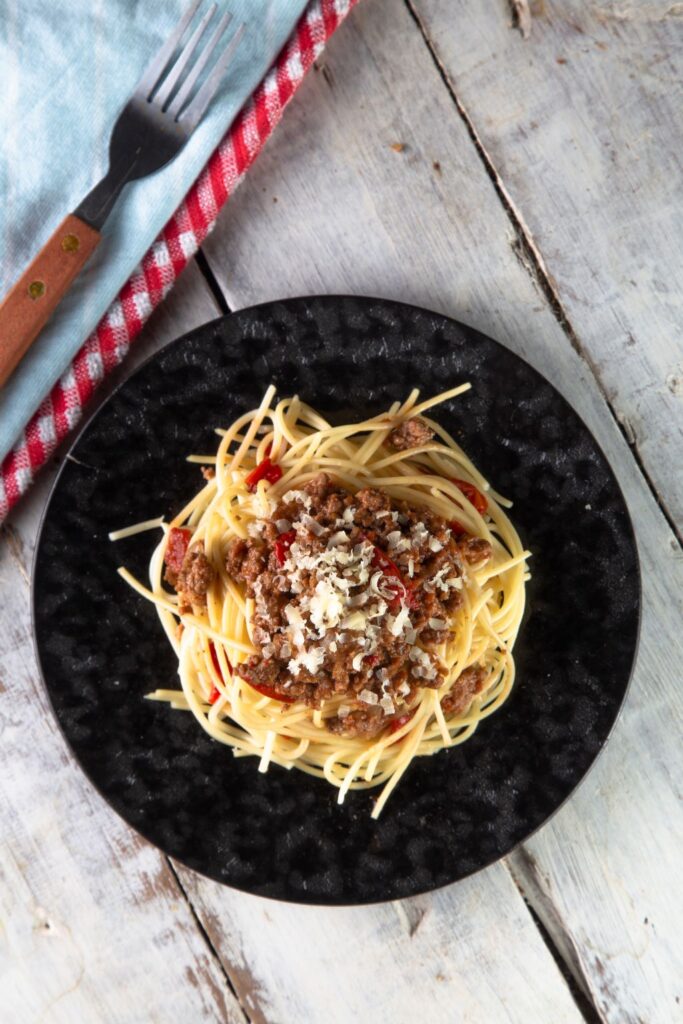 slow cooker spaghetti bolognese on a plate.