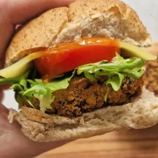 spicy bean burger in a bap with salad and sauce