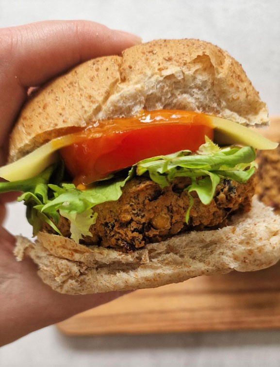 spicy bean burger in a bap with salad and sauce