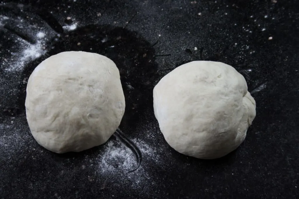 pizza dough split into two