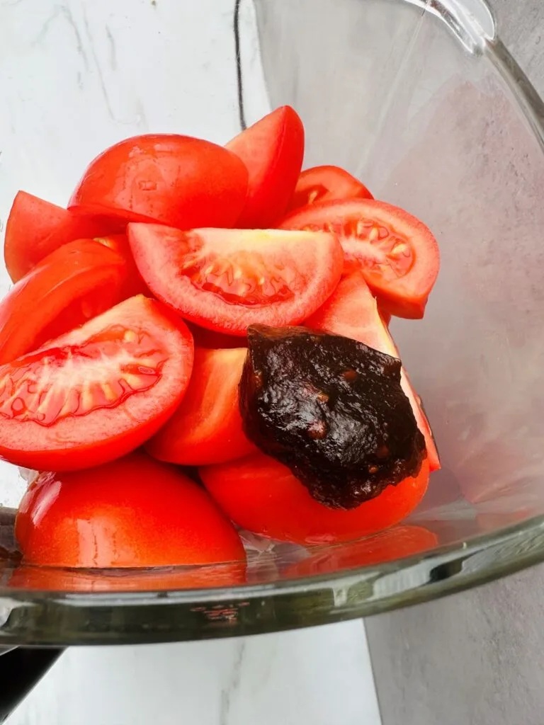 adding stock pot directly to the Ninja soup maker jug on top of the fresh tomatoes