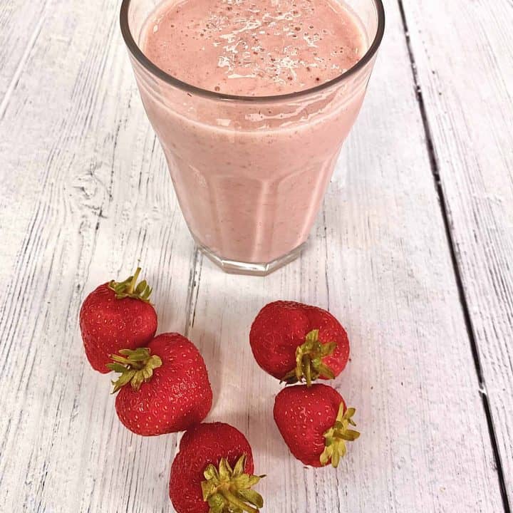 strawberry and banana smoothie with fresh strawberries