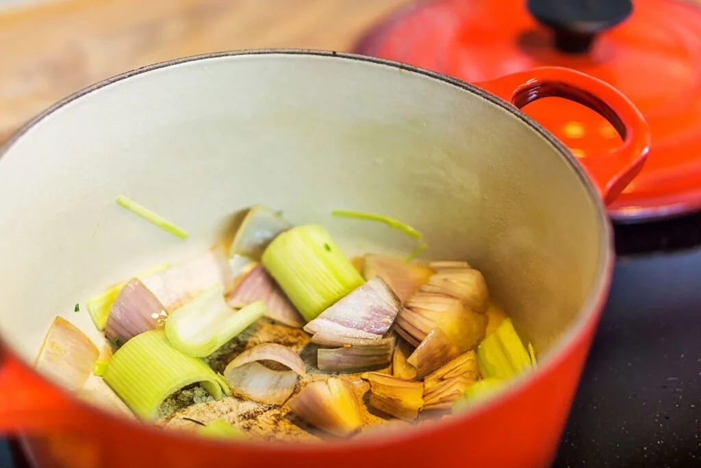 sweating vegetables in a pot