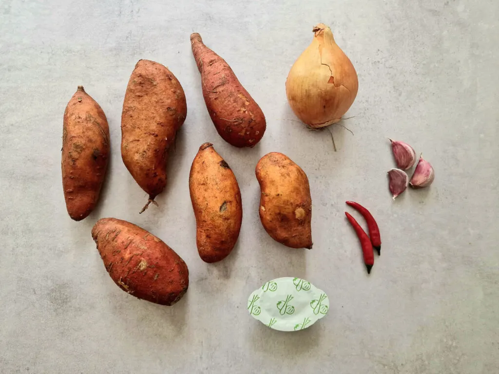 6 sweet potatoes, 1 onion, 3 garlic cloves, 2 red birds eye chillies and 1 vegetable stock pot