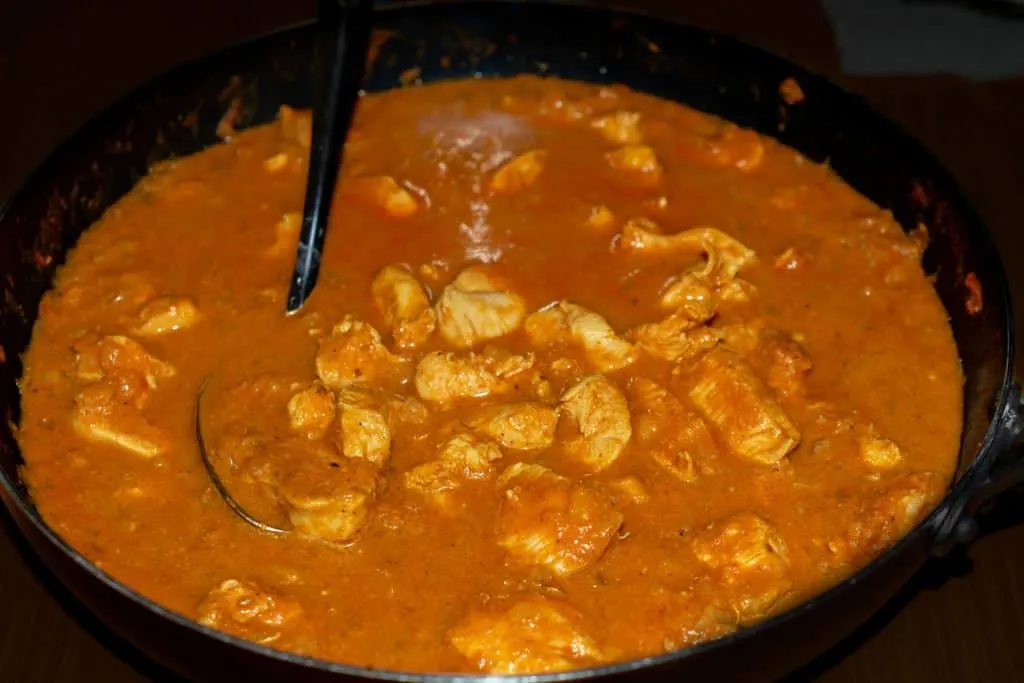 simmering a curry sauce to thicken it up