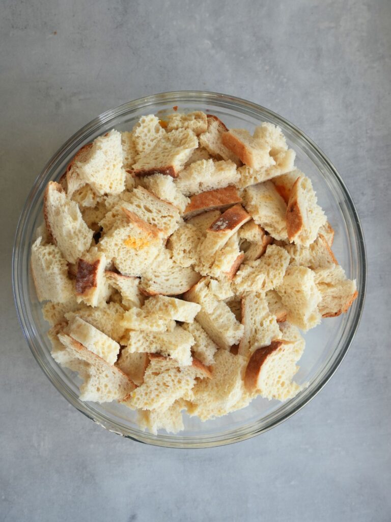 torn up bread in a glass bowl
