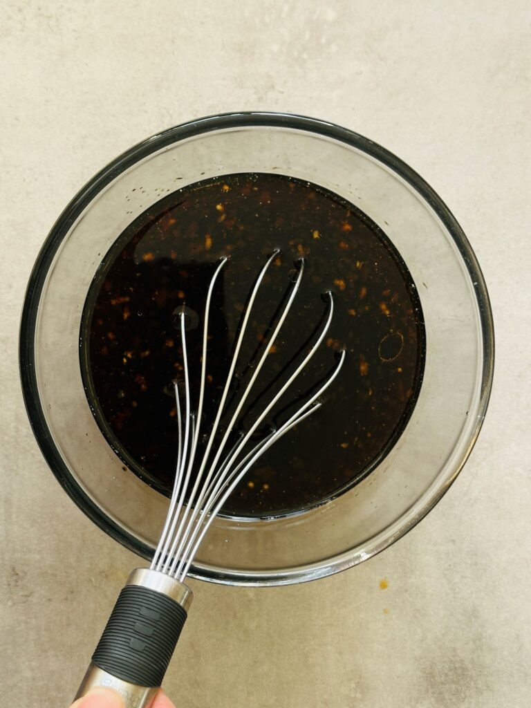sauce in a bowl with a whisk