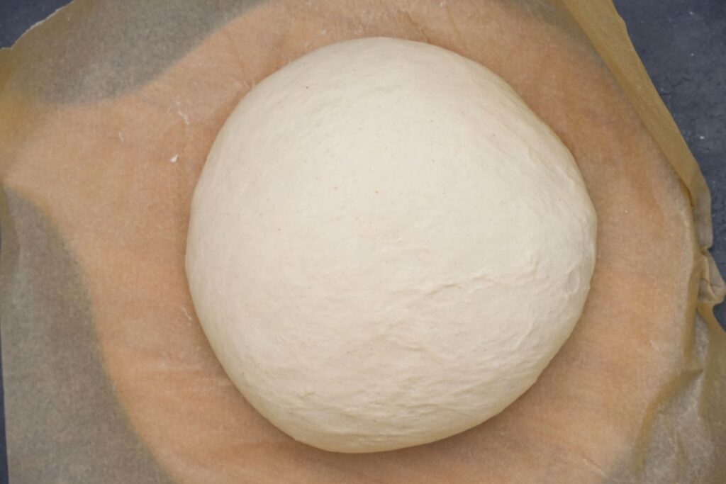 white bread dough on parchment paper